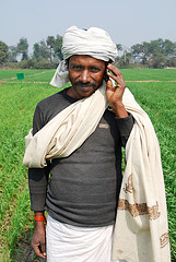 Farmer with his mobile phone.